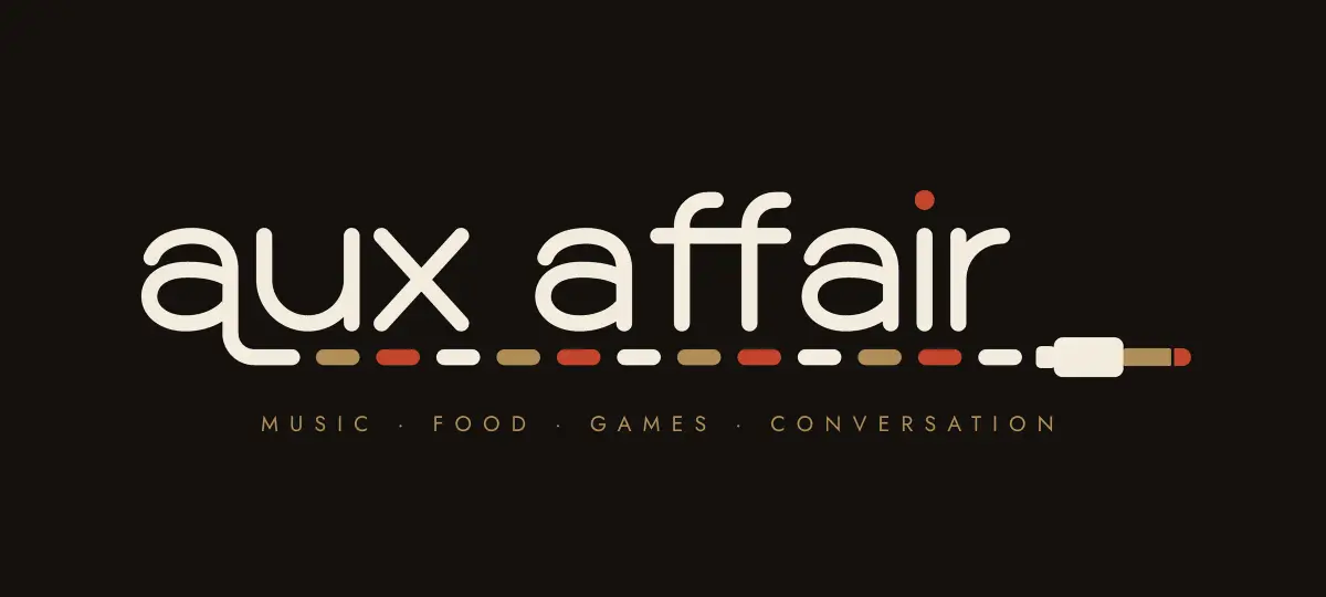 Aux Affair logo: a lowercase wordmark whose last stroke runs out into a dashed audio cable in brass, ivory and ember, ending in a 3.5 mm plug.